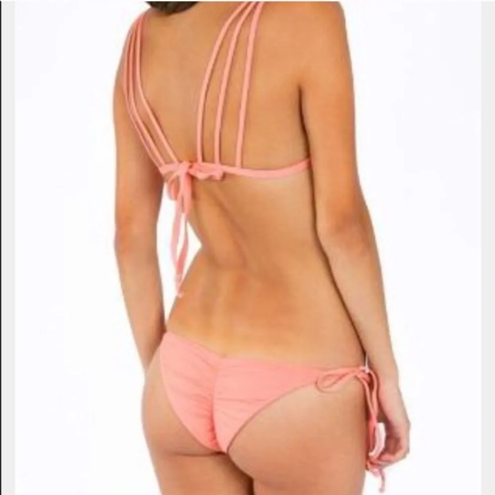 Frankie’s bikinis “Mistos” scrunch bottom in coral. Size M